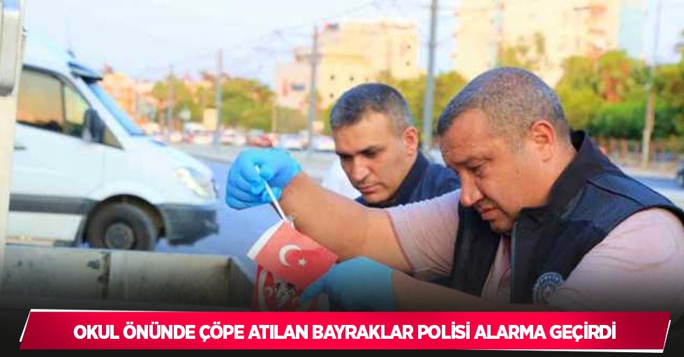 Okul önünde çöpe atılan bayraklar polisi alarma geçirdi