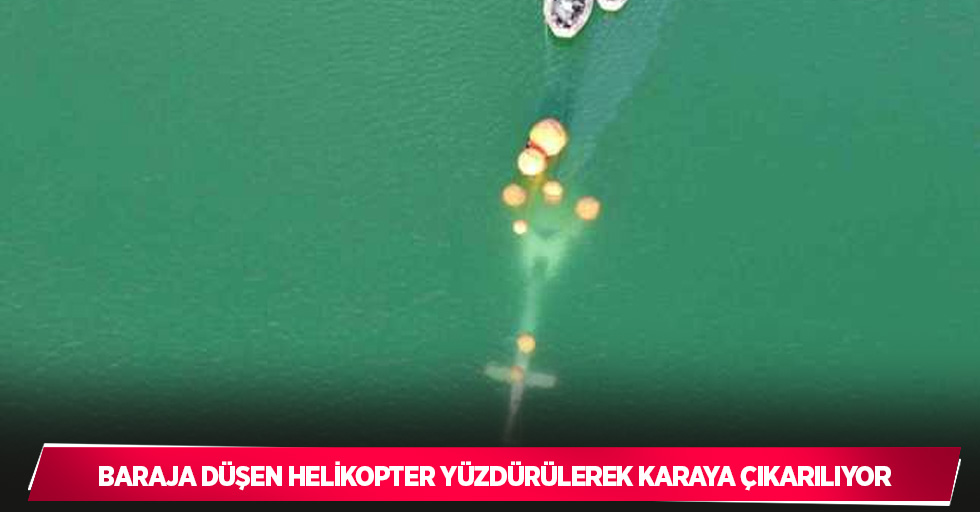 Baraja düşen helikopter yüzdürülerek karaya çıkarılıyor