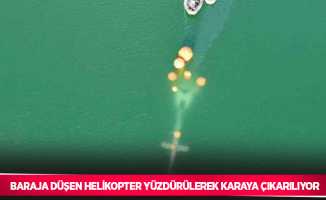 Baraja düşen helikopter yüzdürülerek karaya çıkarılıyor