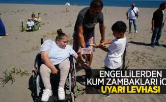 Engellilerden kum zambakları için uyarı levhası